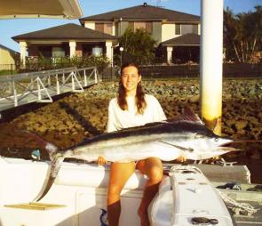 Visiting Angler Amanda Siret from New Caledonia with her first black marlin caught aboard Water Rat on a lumo Sea Witch.